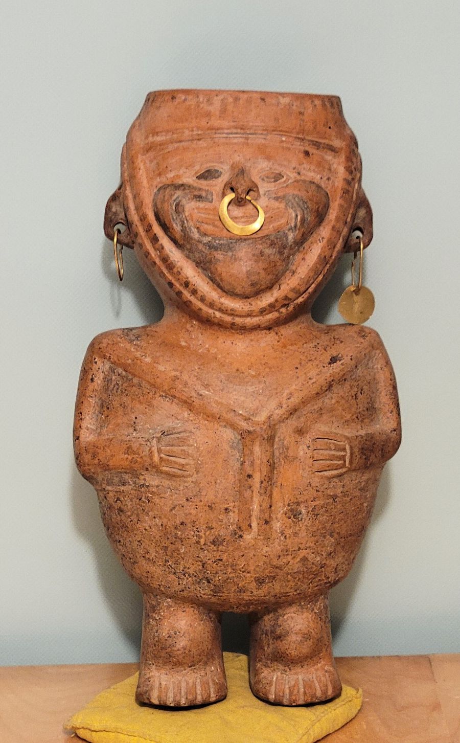 Standing terracotta Nayarit figure from West Mexico wearing a 24k gold nose ring and ear ornaments